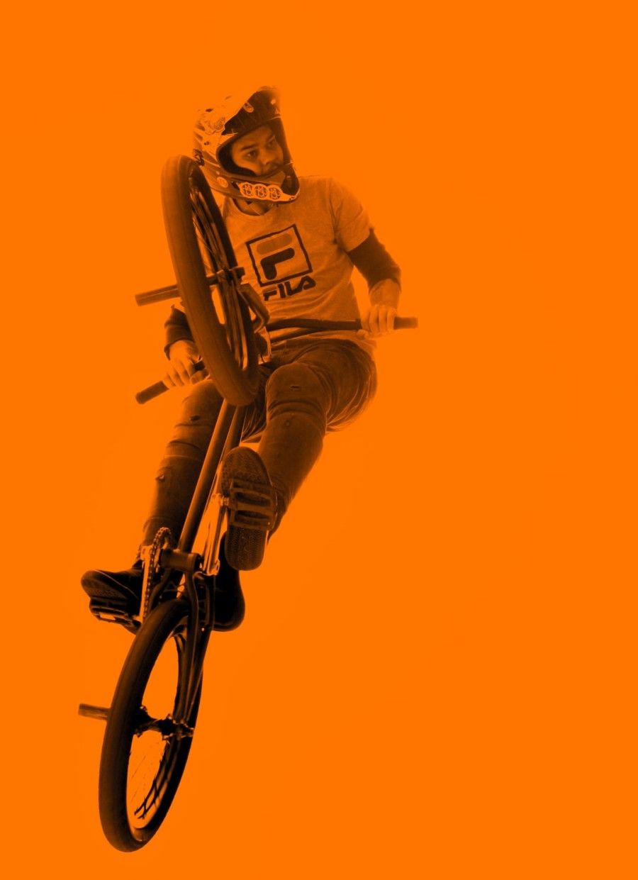 man-riding-bmx-bicycle-while-doing-tricks