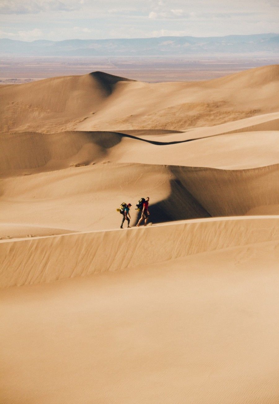 people-walking-in-the-desert-during-daytime