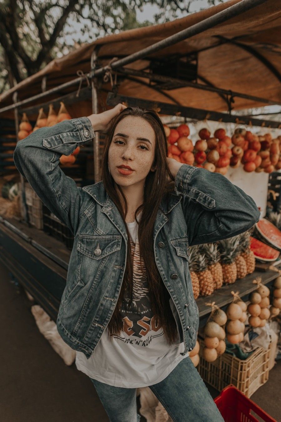 woman-standing-in-front-of-fruit-stand-selective-focus-photography