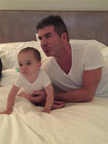 amazing-pictures-simon-cowell-and-baby-son-eric-have-the-same-style-and-angry-resting-face