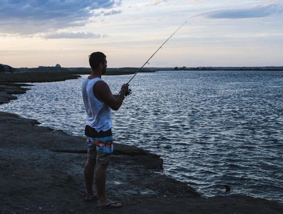 man-fishing-on-rocky-shore