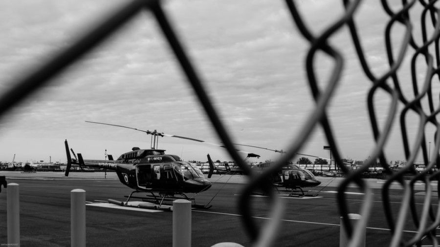 selective-focus-photography-of-black-helecopter