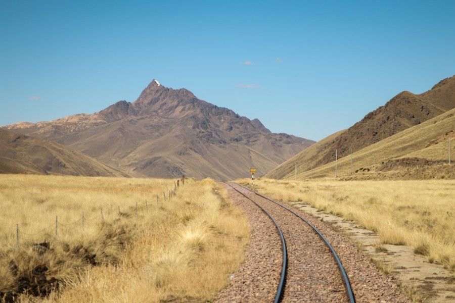 train-track-near-mountains-during-day